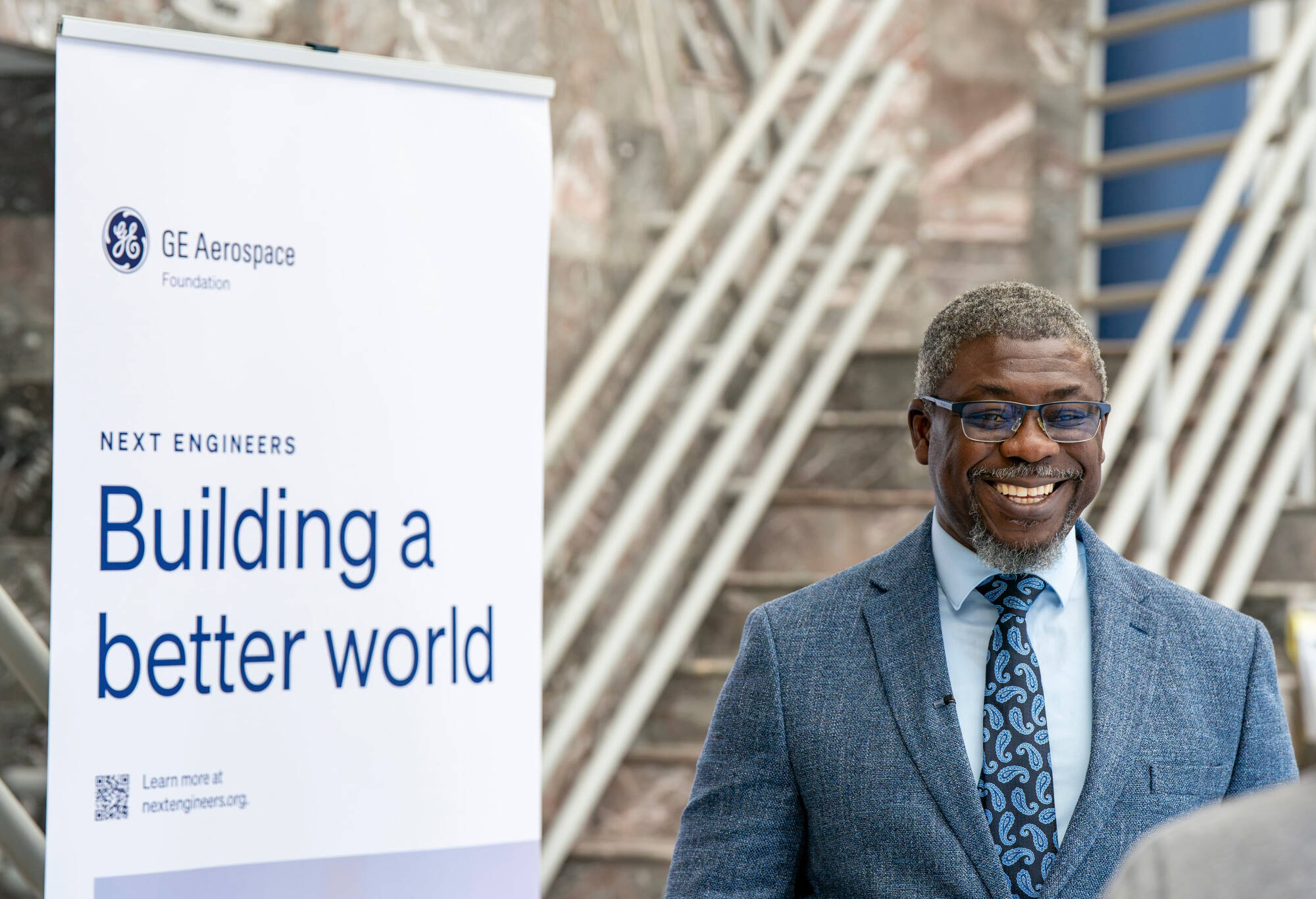 Dean Ogundipe smiling at news conference